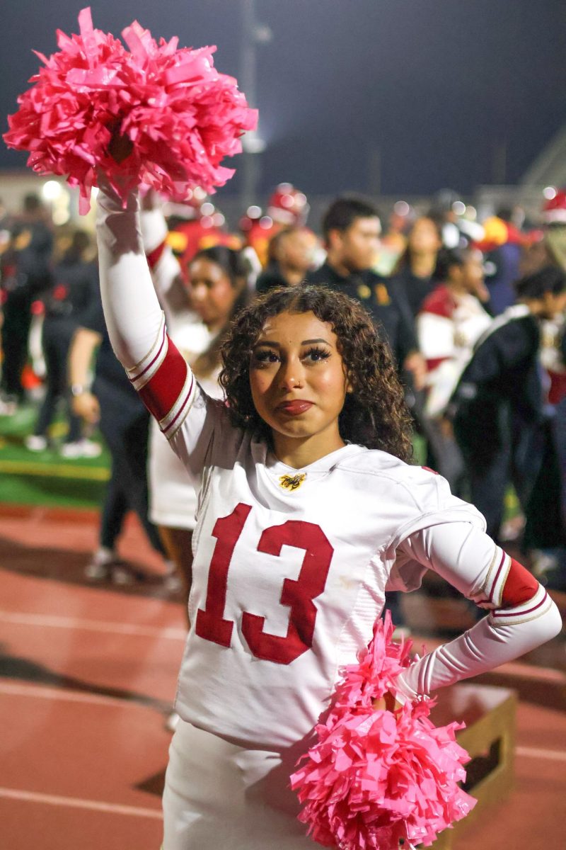On Oct. 4 Sophia Chavez (12) cheers for the football team at Bud Houser field after a touchdown.
